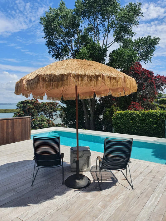 240cm shade canopy raffia thatch umbrella by poolside with lounge chairs and tree background