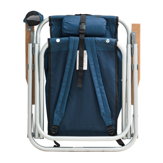 Beachkit Wearever Backpack Chair folded with blue fabric, silver frame, wooden armrests, and backpack straps for portable seating