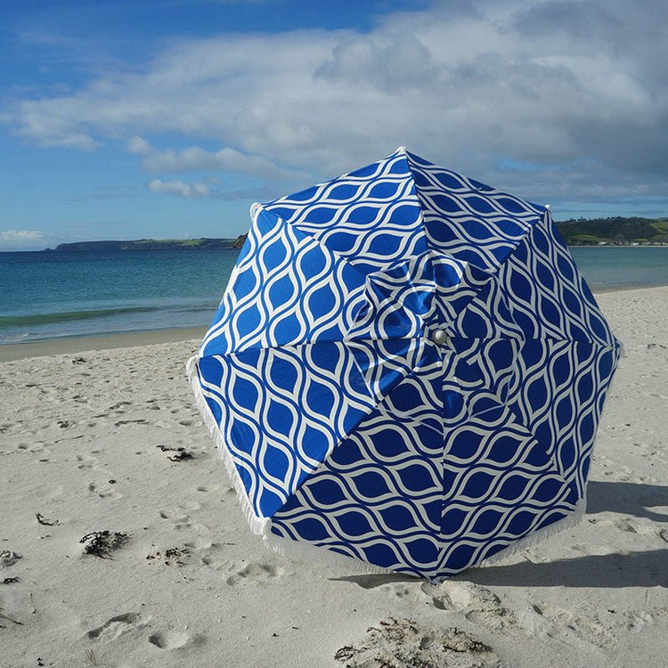 Classic Fringe Beach Umbrella Moroccan Blue 210cm with cotton canopy and retro fringe on sandy beach