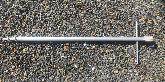 Lower replacement pole for 210cm umbrellas lying on gravel surface